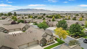 Aerial view of residential area featuring a mountain backdrop