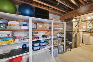 Storage area featuring washer / clothes dryer