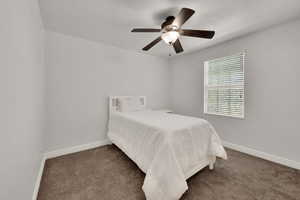 Bedroom with carpet and a ceiling fan