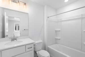Bathroom featuring vanity and bathing tub / shower combination