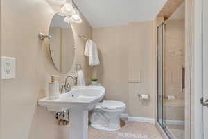 Full bathroom with a stall shower and light tile patterned floors