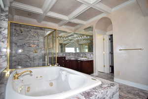 Full bathroom with a whirlpool tub, beamed ceiling, vanity, coffered ceiling, and a marble finish shower