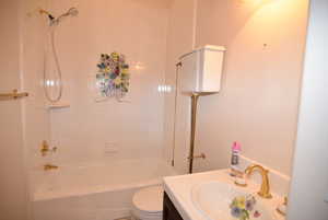Bathroom with shower / bathtub combination and vanity