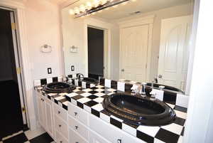 Full bathroom with a sink