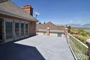 View of patio featuring a water and mountain view
