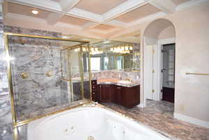 Full bathroom with a marble finish shower, beamed ceiling, vanity, a jetted tub, and coffered ceiling
