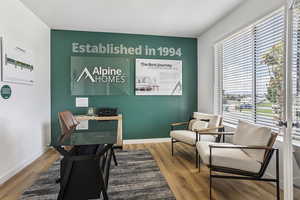 Office space with light wood finished floors and baseboards