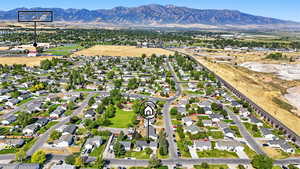 Aerial perspective of suburban area featuring a mountain backdrop