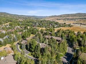 Aerial view of property's location with nearby suburban area