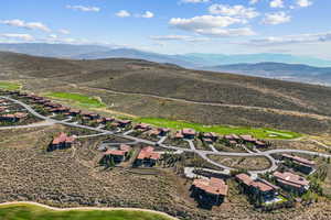 View of property location with mountains and a golf course