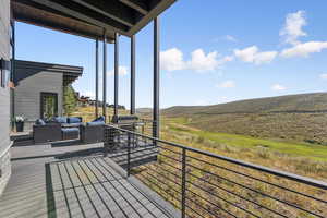 Wooden deck featuring an outdoor hangout area