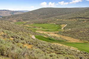 View of mountain backdrop with a golf club
