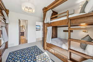 Carpeted bedroom with ensuite bathroom