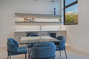 Dining room with baseboards and wine cooler