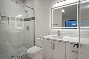 Full bath featuring vanity and a stall shower