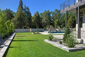 Fenced backyard with a patio area