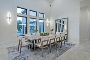Dining space featuring a high ceiling