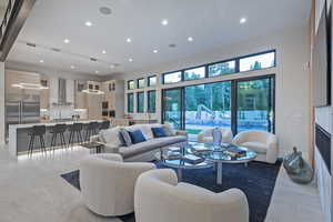 Living area with recessed lighting and plenty of natural light