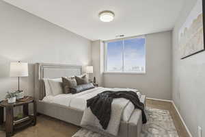 Bedroom with carpet and baseboards