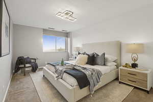 Bedroom with carpet flooring and baseboards