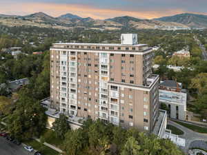 Bird's eye view of a mountain backdrop and apartment complex / building