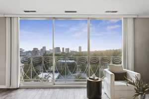 Sunroom featuring a view of skyline