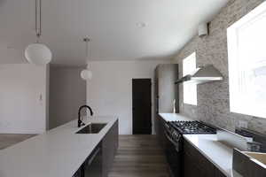 Kitchen featuring black appliances, hanging light fixtures, dark wood-style floors, and modern cabinets