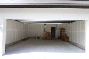 Garage featuring electric panel