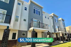 Back of property featuring stucco siding and a balcony