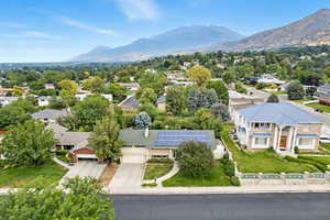 Aerial view of residential area featuring a mountainous background