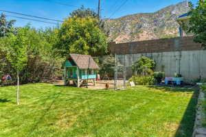 View of yard featuring exterior structure and an outbuilding