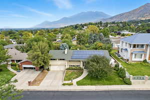 Aerial perspective of suburban area with a mountainous background
