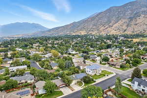 Aerial perspective of suburban area featuring a mountainous background