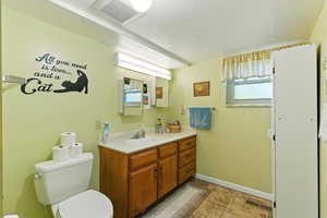 Bathroom with vanity and toilet