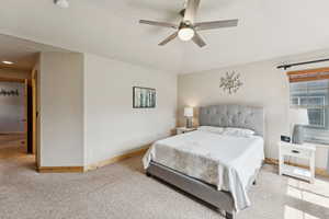 Bedroom with carpet floors and a ceiling fan