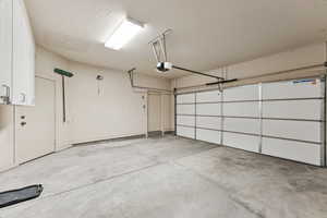 Garage featuring a garage door opener