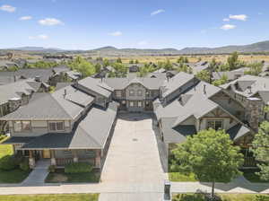 Aerial view of residential area featuring a mountainous background