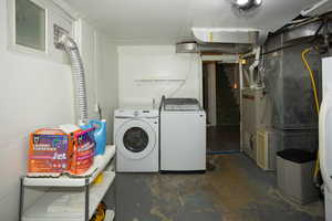 Washroom featuring washer and clothes dryer
