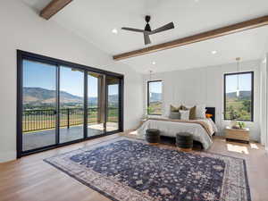 Bedroom with a mountain view, access to outside, light wood-style flooring, recessed lighting, and ceiling fan