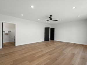 Unfurnished bedroom with recessed lighting, light wood-style floors, a ceiling fan, and connected bathroom