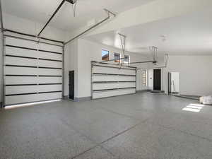 Garage featuring baseboards