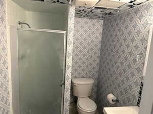Bathroom featuring a shower stall