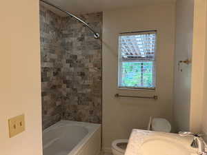 Bathroom with shower / bath combination and vanity