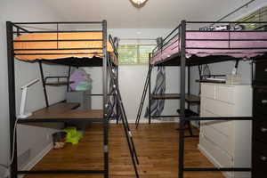 Unfurnished bedroom featuring light wood finished floors