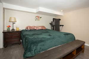 Bedroom featuring dark wood-style floors and recessed lighting