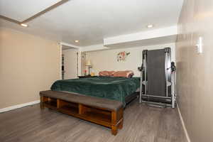 Bedroom with recessed lighting and wood finished floors
