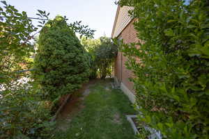 View of side of home with brick siding