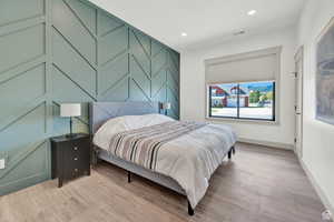 Bedroom featuring light wood-style flooring and recessed lighting