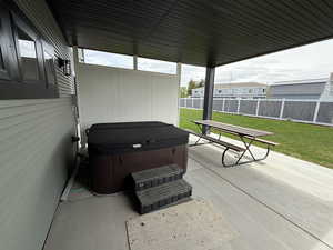 View of patio / terrace featuring a hot tub