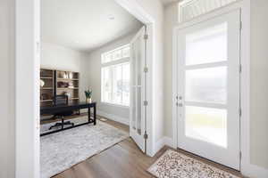 Office space featuring wood finished floors and baseboards